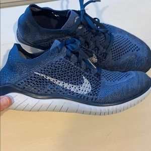 Navy Nike Flyknit running shoes - women’s